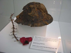 Helmet, barbed wire and poppy from the Imperial War Museum 2008 exhibition "In Memoriam".