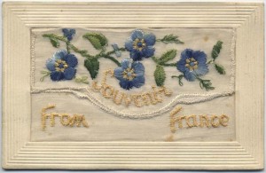 A Great War silk postcard embroidered with forget-me-nots.