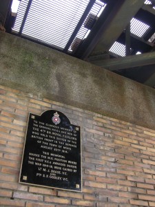 Plaque at Nimy Railway Bridge commemorating the actions of Dease and Godley.