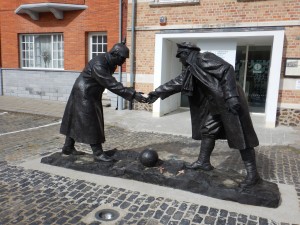 "All Together Now Christmas Truce WWI statue" Belgium.